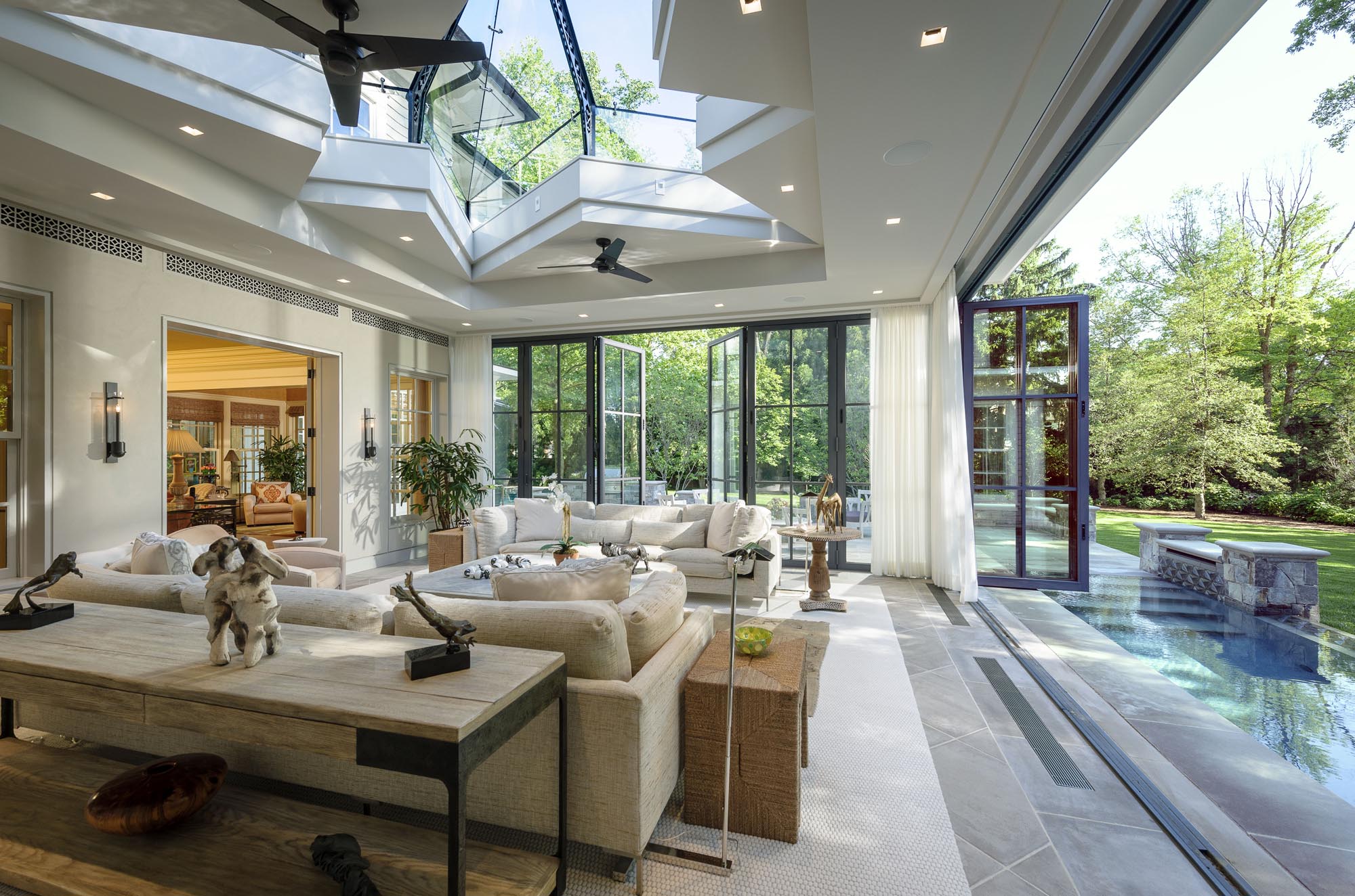 modern orangeries | interior view with pool and opened doors