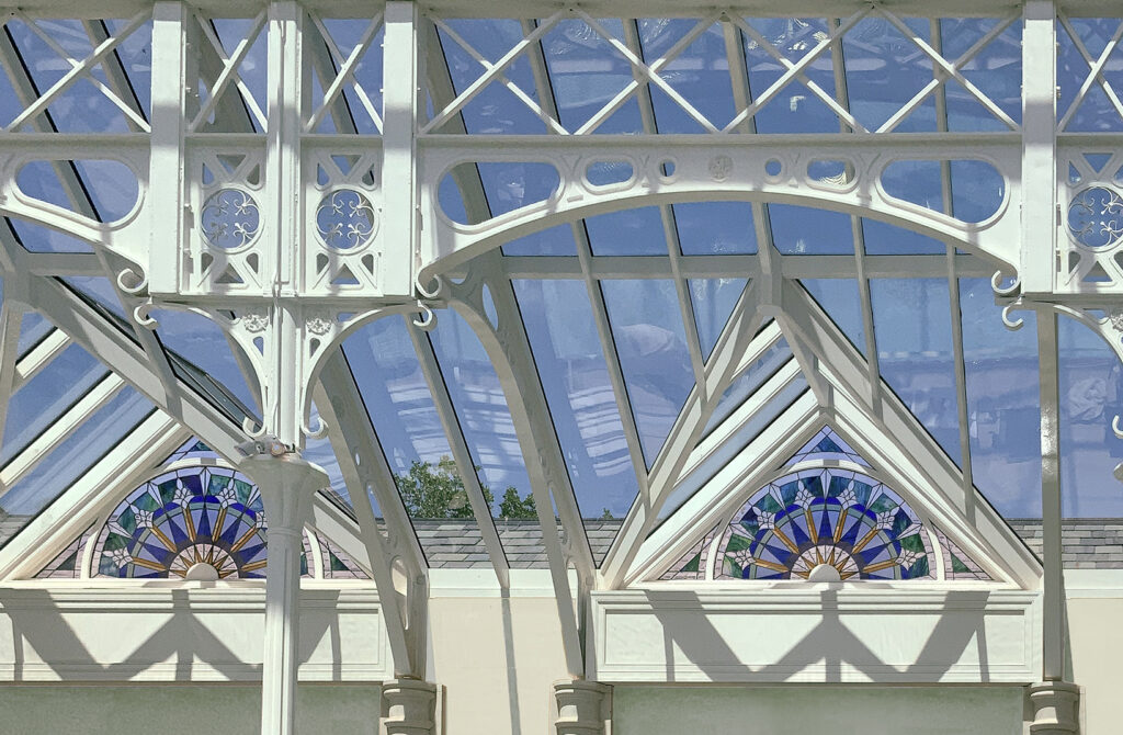 Steel and Glass Pool Enclosure with Stained Glass Windows by Tanglewood Conservatories